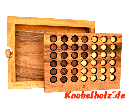 Strategy Game Connect Four as wooden game version with chips made of wood